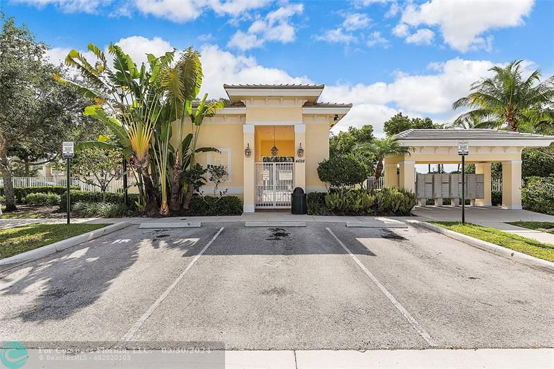 7774 Paddock Place, Unit 7774 Davie, FL 33328 - Photo 28 of 28 a view of a white house with a swimming pool