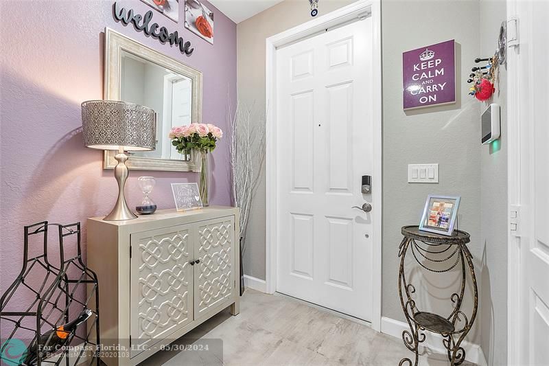 7774 Paddock Place, Unit 7774 Davie, FL 33328 - Photo 4 of 28 a bed room with a bed and a chair in it