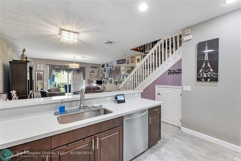 7774 Paddock Place, Unit 7774 Davie, FL 33328 - Photo 9 of 28 a kitchen with a sink and a refrigerator