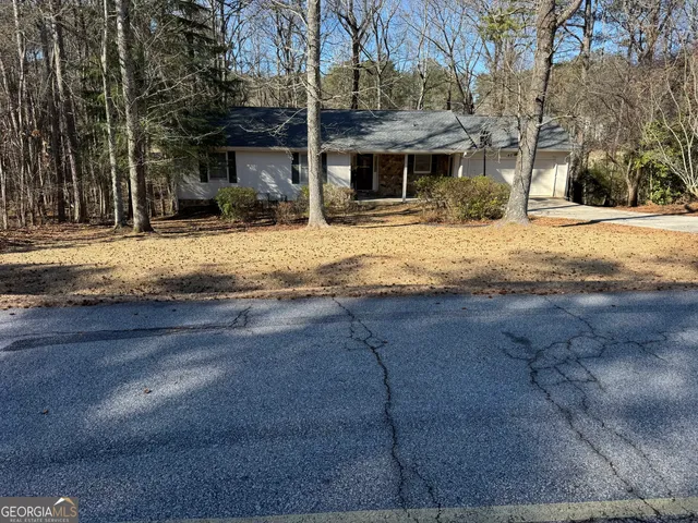a view of street with with large trees
