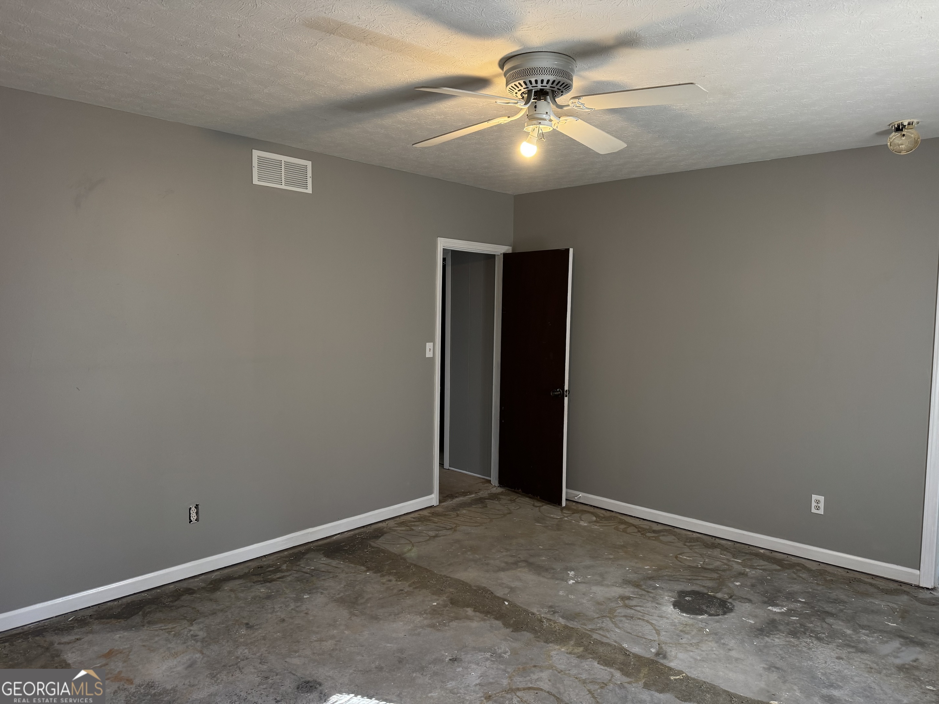 4055 Golfview Drive Villa Rica, GA 30180 - Photo 17 of 28 an empty room with a ceiling fan and carpet