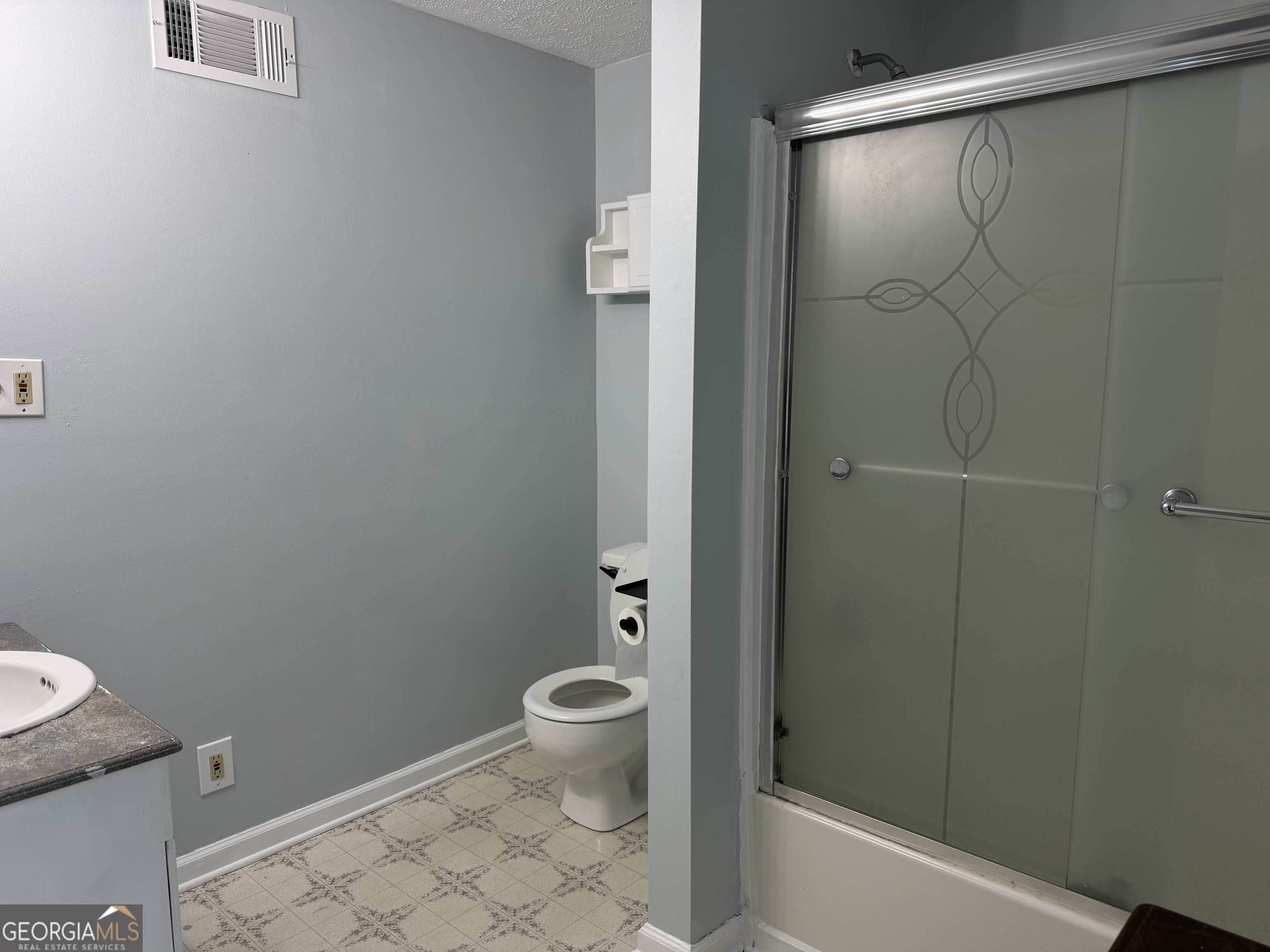 4055 Golfview Drive Villa Rica, GA 30180 - Photo 18 of 28 a bathroom with a shower and a toilet