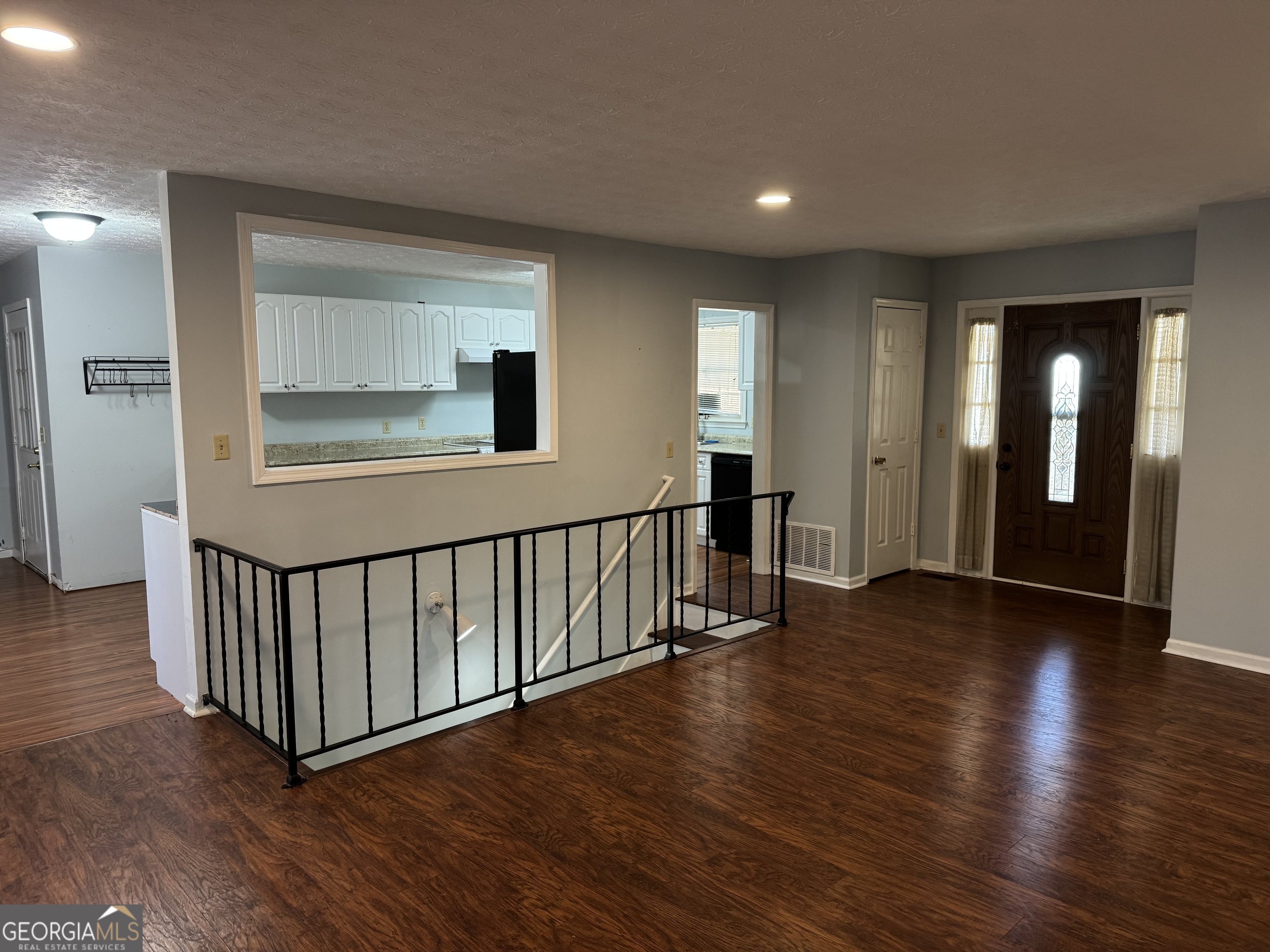 4055 Golfview Drive Villa Rica, GA 30180 - Photo 6 of 28 a view of a hallway with wooden floor