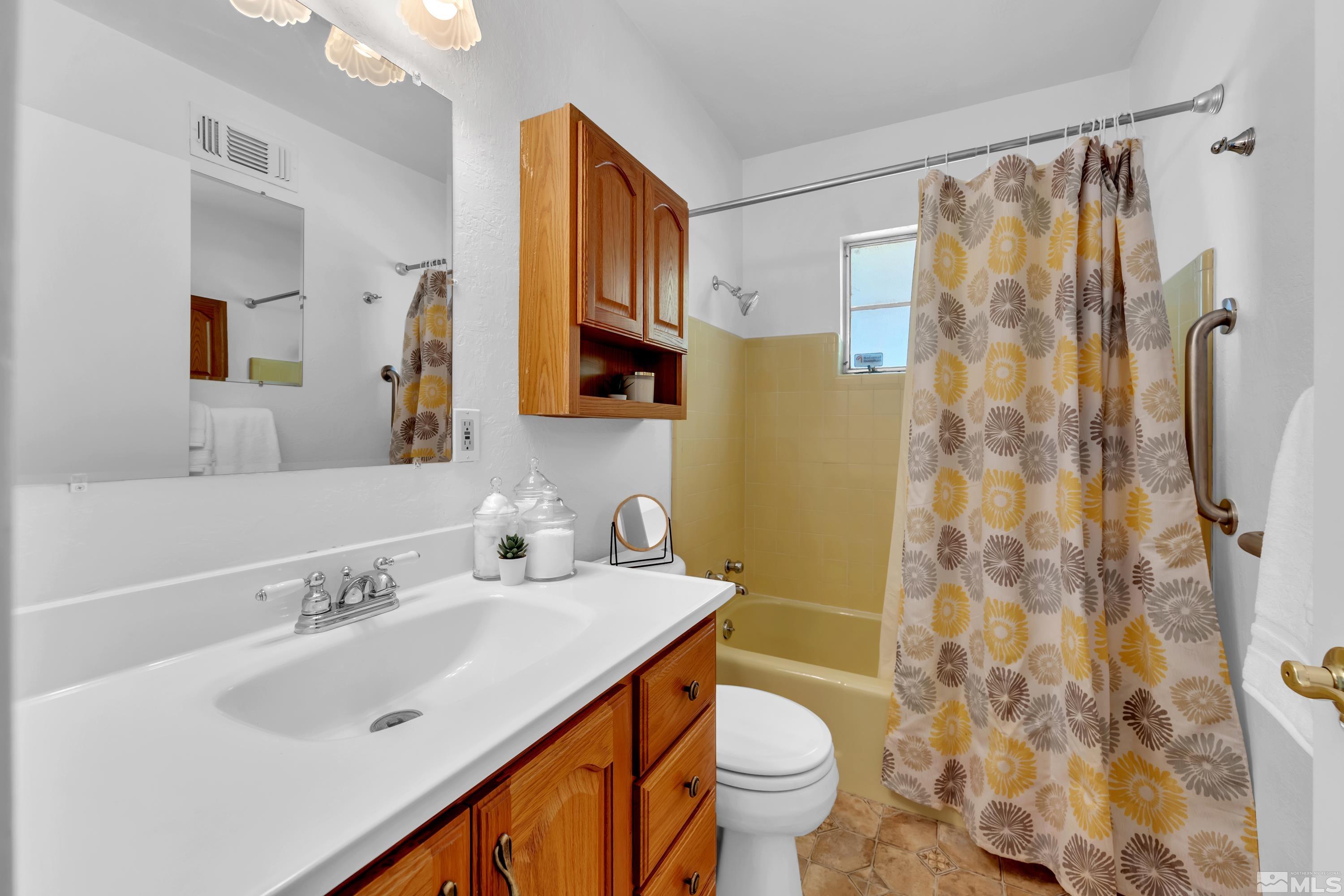 3075 West Plumb Lane Reno, NV 89509 - Photo 29 of 40 a bathroom with a sink toilet and shower