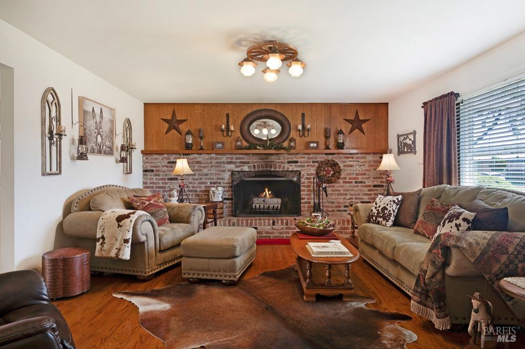 23180 Maffei Road Sonoma, CA 95476 - Photo 17 of 61 Brick fire place and a raised hearth.