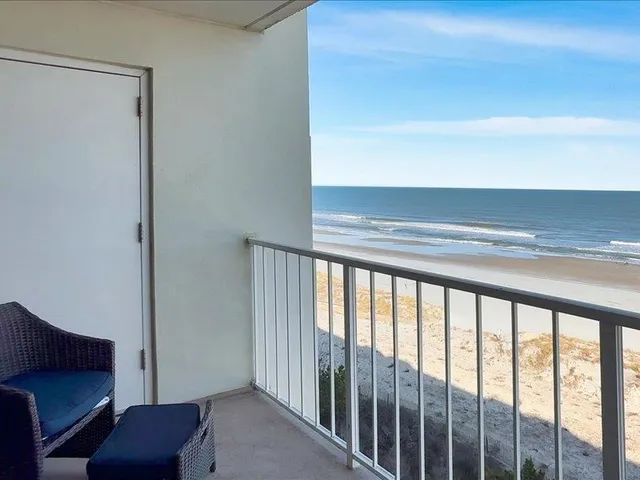a view of balcony with furniture