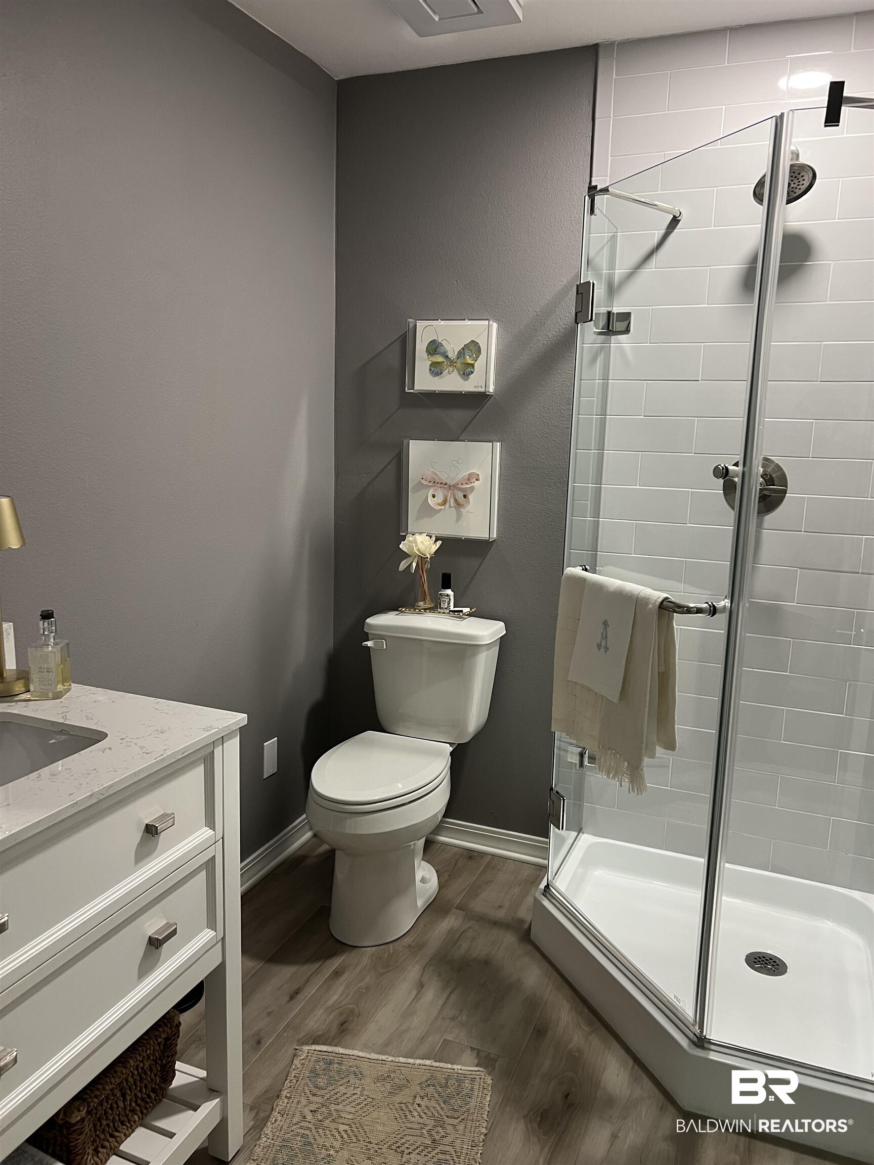 119 Destrehan Road Fairhope, AL 36532 - Photo 37 of 38 Full bath with dark wood-style floors, a shower stall, and vanity