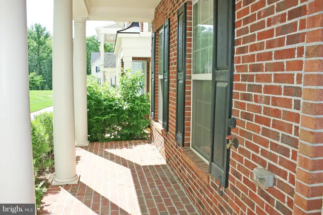 a view of a balcony with wooden floor