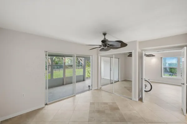 a view of a room with sliding glass door and chandelier