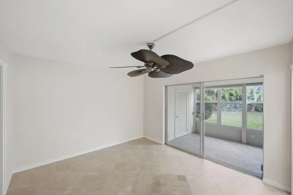 a view of a room with a ceiling fan