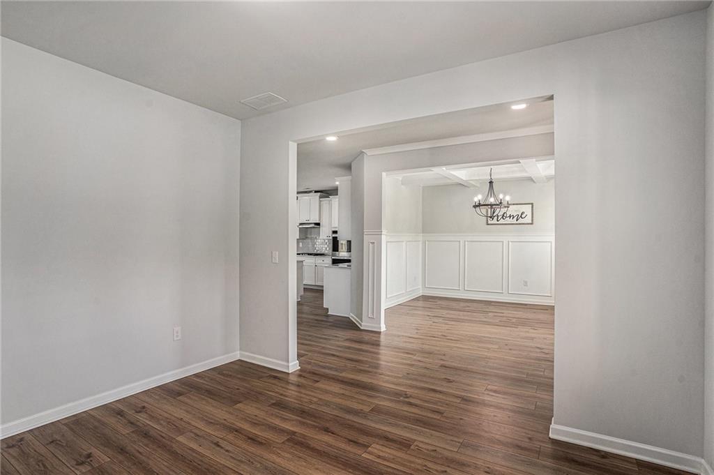 953 Mystic Way Hampton, GA 30228 - Photo 18 of 51 a view of empty room with wooden floor