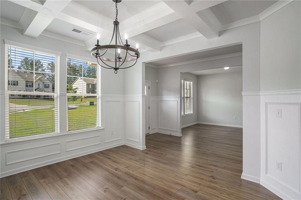 953 Mystic Way Hampton, GA 30228 - Photo 20 of 51 a view of an empty room with wooden floor and a window