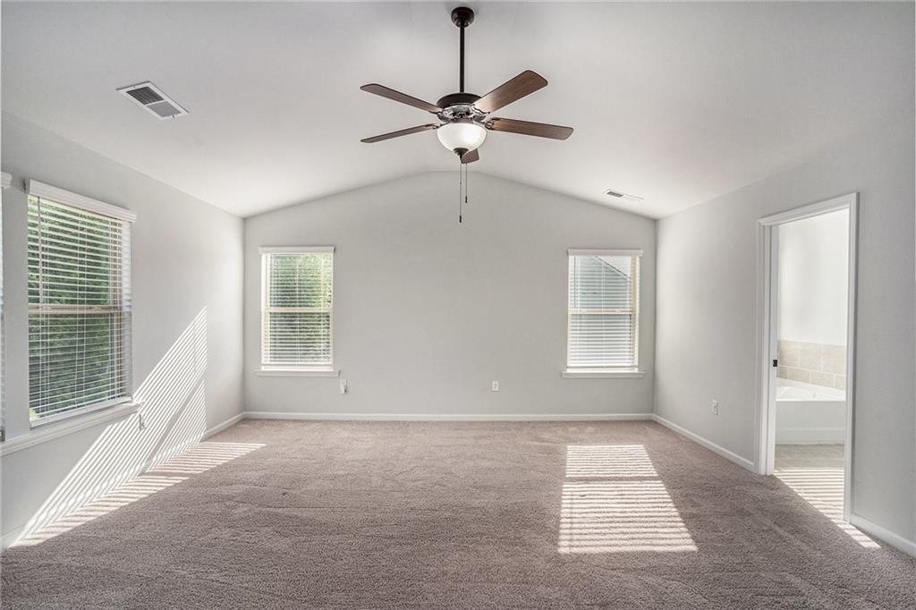 953 Mystic Way Hampton, GA 30228 - Photo 22 of 51 a view of a livingroom with a ceiling fan and window