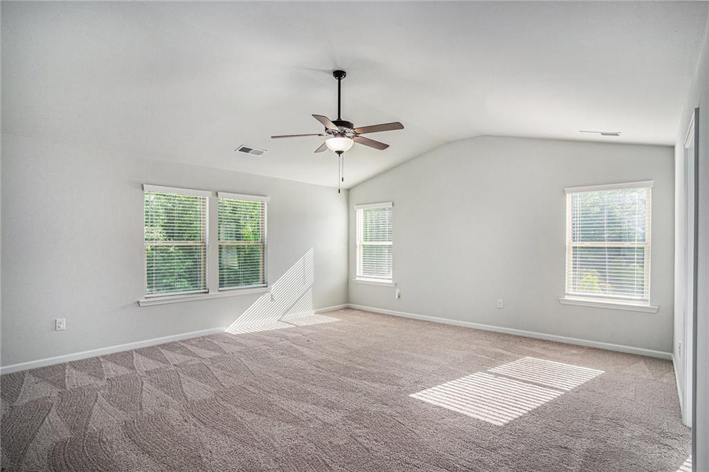 953 Mystic Way Hampton, GA 30228 - Photo 24 of 51 an empty room with a window and a ceiling fan