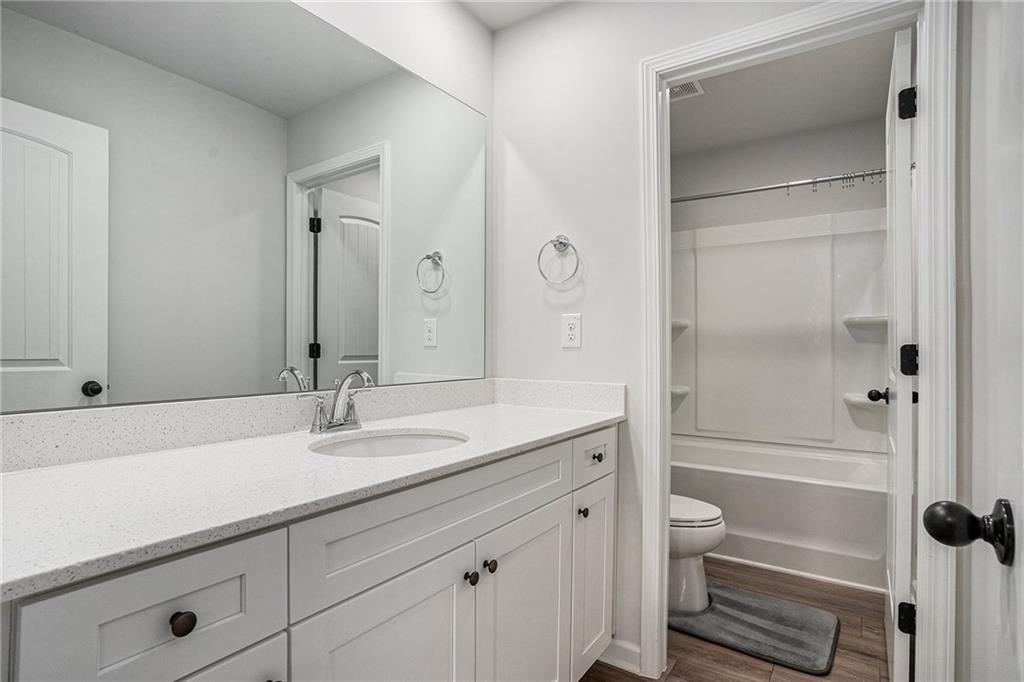 953 Mystic Way Hampton, GA 30228 - Photo 35 of 51 a bathroom with a sink a toilet and shower