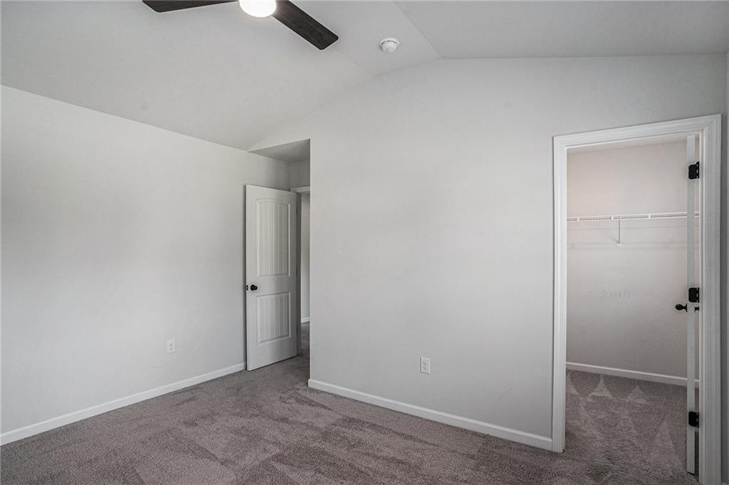 953 Mystic Way Hampton, GA 30228 - Photo 39 of 51 an empty room with closet and windows