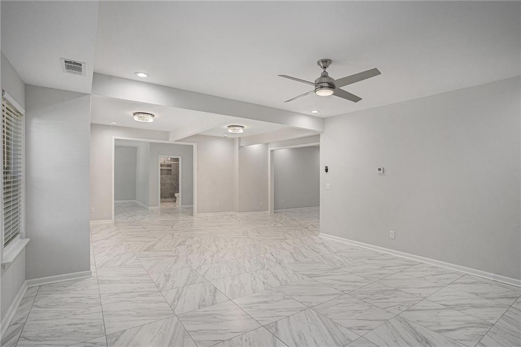 953 Mystic Way Hampton, GA 30228 - Photo 44 of 51 a view of a livingroom with a ceiling fan & kitchen view