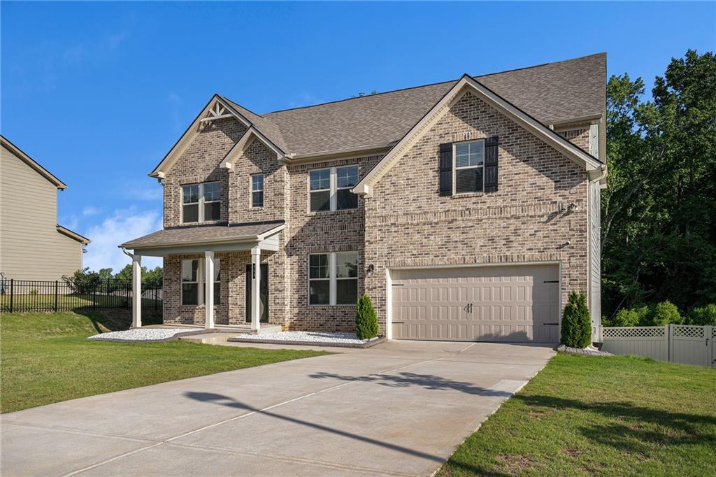 953 Mystic Way Hampton, GA 30228 - Photo 5 of 51 a front view of a house with a garden