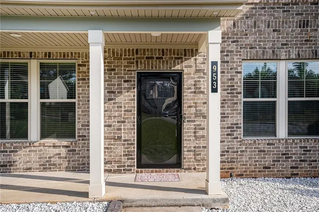 a front view of a house with glass windows