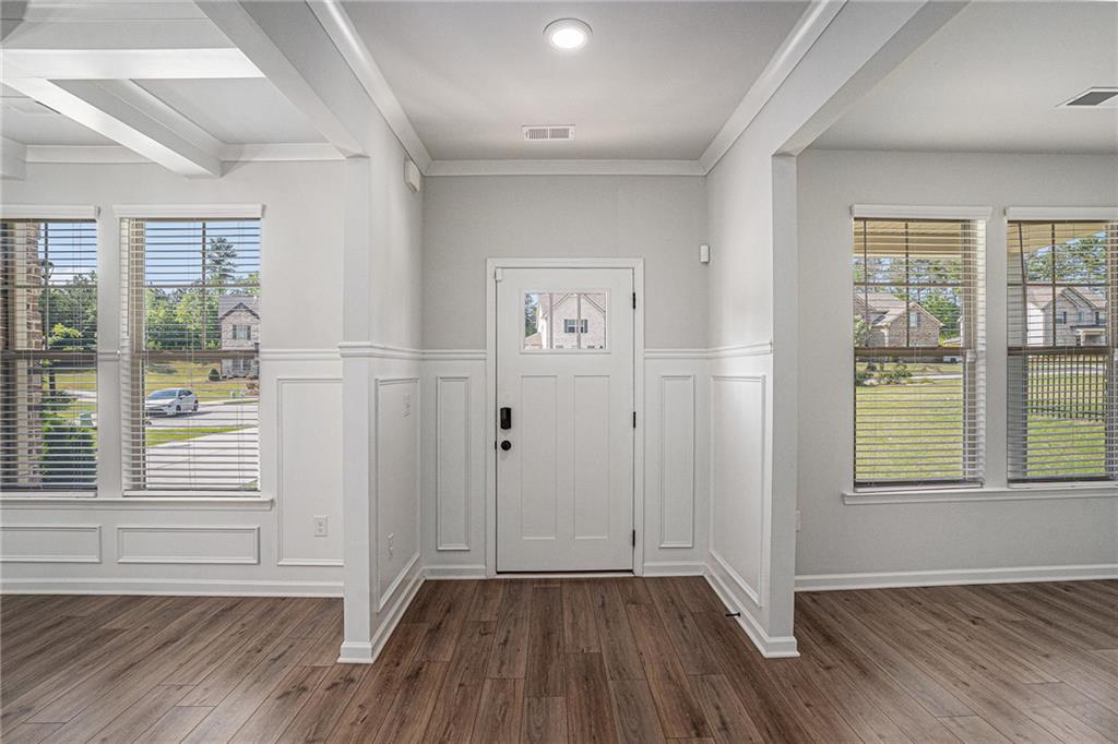 953 Mystic Way Hampton, GA 30228 - Photo 7 of 51 an empty room with wooden floor and windows
