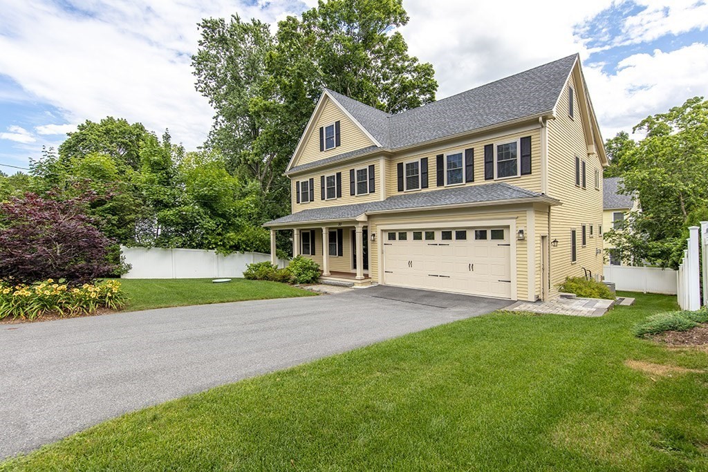 33 Liberty Avenue Lexington, MA 02420 - Photo 1 of 30 a front view of a house with a yard and porch