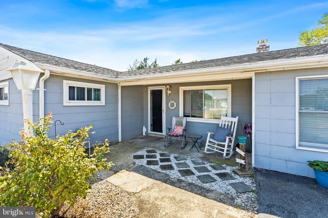 a view of a house with outdoor seating