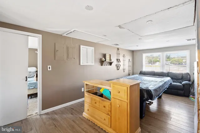 a room with furniture and wooden floor