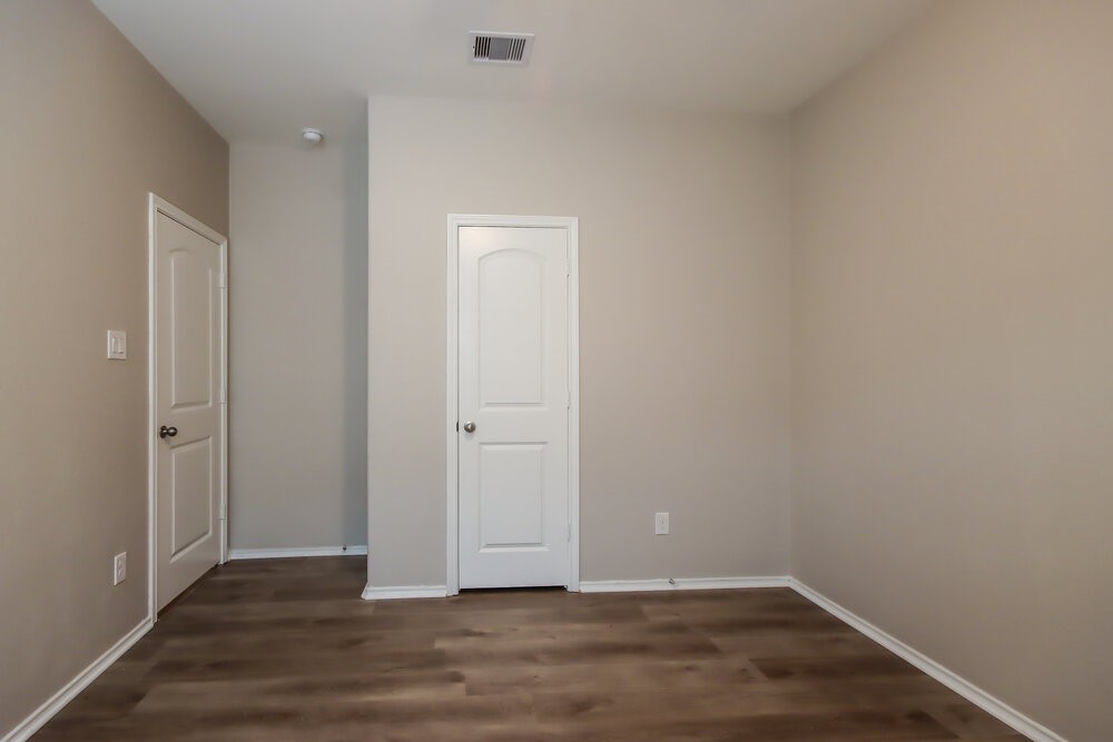 18378 Timbermill Lane New Caney, TX 77357 - Photo 12 of 16 a view of an empty room with wooden floor