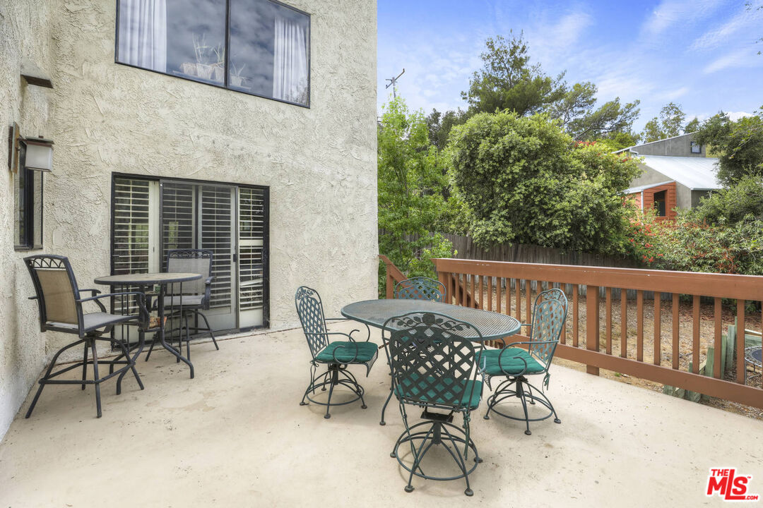 1926 Corral Canyon Road Malibu, CA 90265 - Photo 14 of 29 a view of a patio with a table and chairs