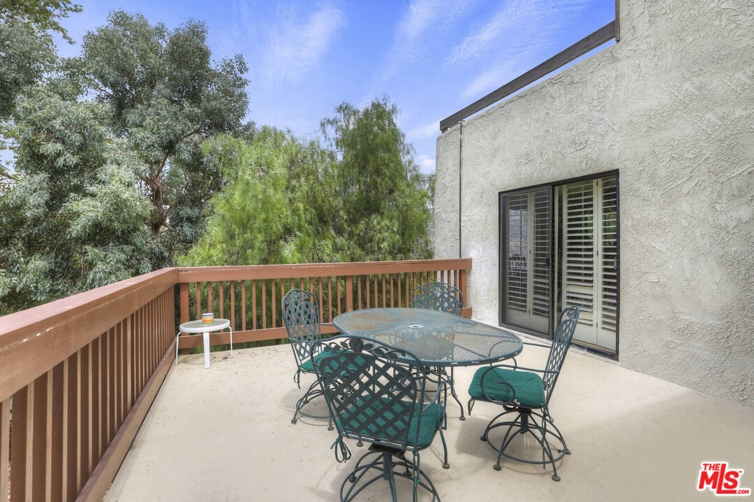 1926 Corral Canyon Road Malibu, CA 90265 - Photo 15 of 29 a view of a chairs and table in the balcony