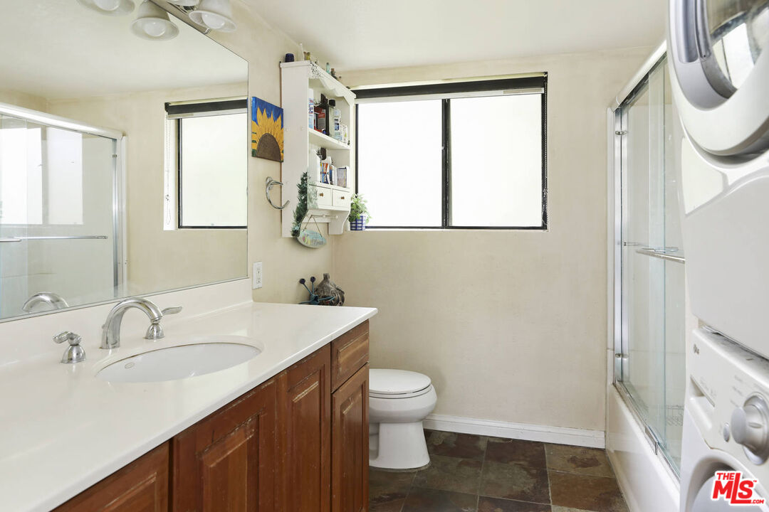 1926 Corral Canyon Road Malibu, CA 90265 - Photo 18 of 29 a bathroom with a sink a toilet and a mirror
