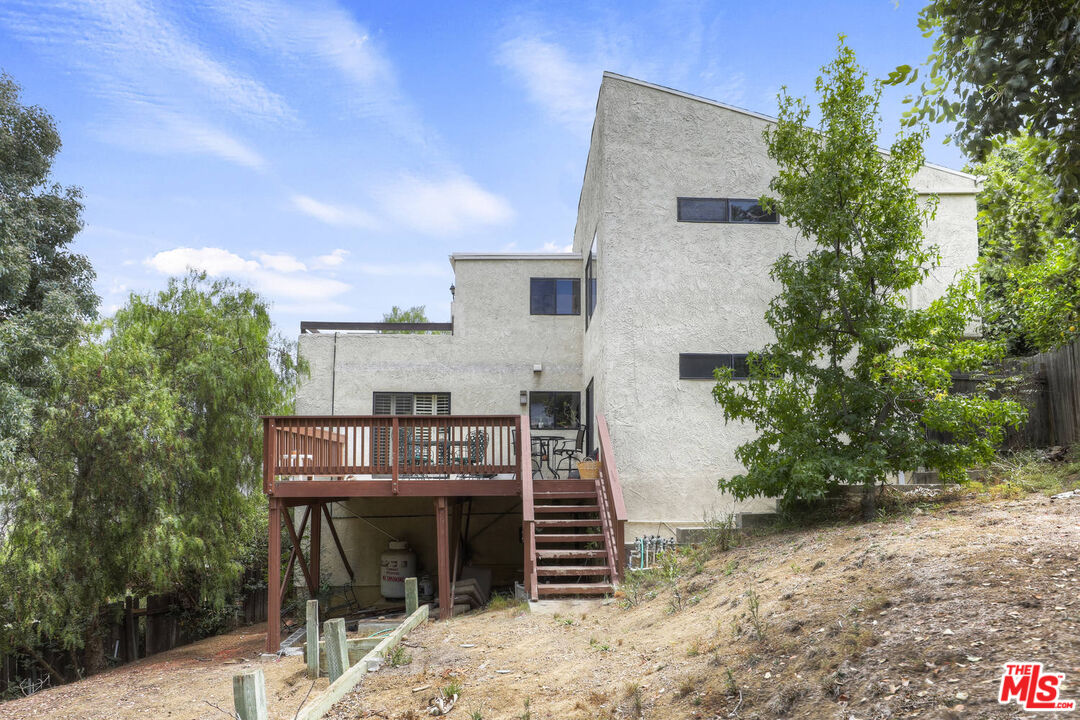 1926 Corral Canyon Road Malibu, CA 90265 - Photo 26 of 29 a view of a house with roof deck and sitting area