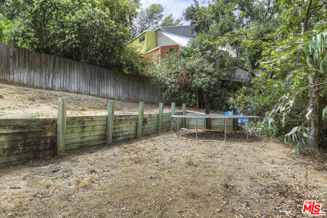 1926 Corral Canyon Road Malibu, CA 90265 - Photo 27 of 29 a backyard of a house with lots of green space