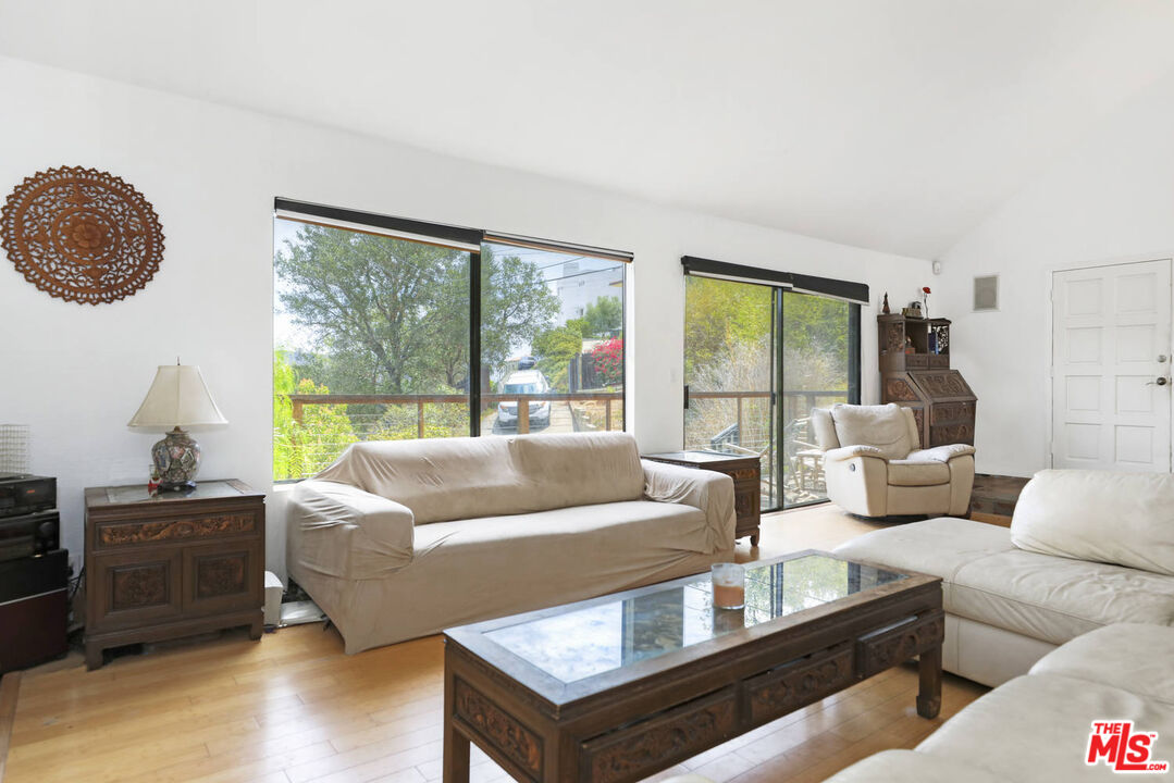 1926 Corral Canyon Road Malibu, CA 90265 - Photo 6 of 29 a living room with furniture and a large window