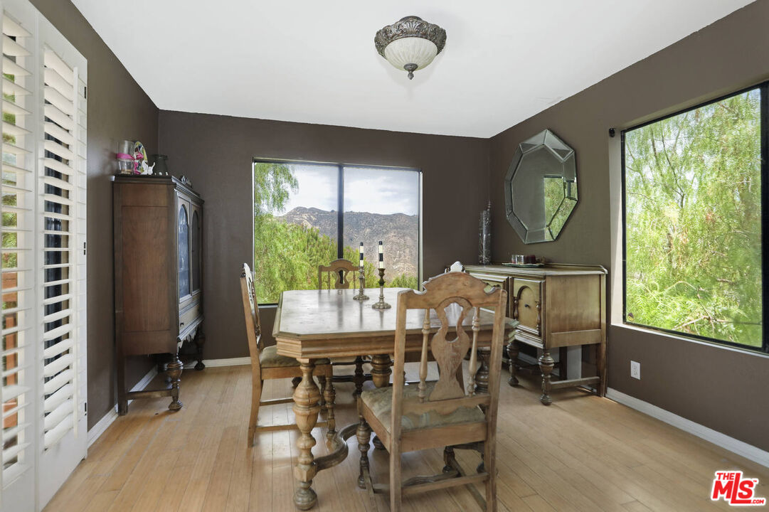 1926 Corral Canyon Road Malibu, CA 90265 - Photo 10 of 29 a view of a dining room with furniture window and outside view