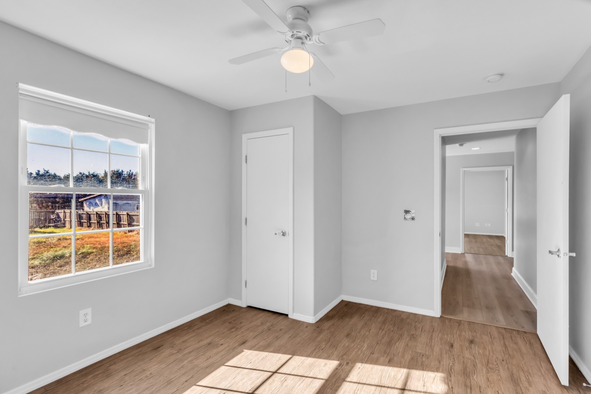 2190 Unionville Deason Road Bell Buckle, TN 37020 - Photo 24 of 34 a view of an empty room with window and wooden floor