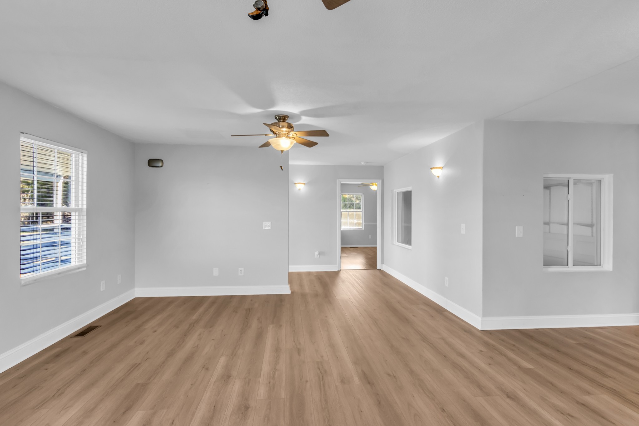2190 Unionville Deason Road Bell Buckle, TN 37020 - Photo 7 of 34 a view of an empty room with wooden floor and a window