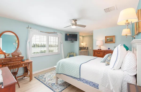 a bedroom with a bed and a table in it