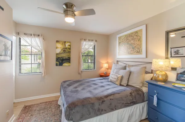 a bedroom with a bed dresser and a window