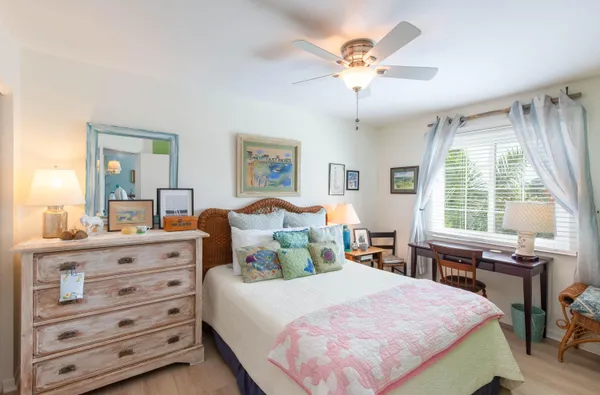 a bed room with a bed and a table