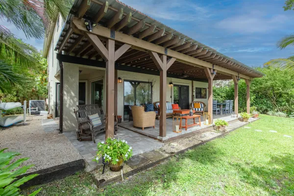 a view of a backyard with a patio