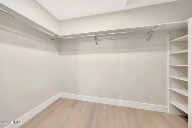 a bathroom with a double vanity sink toilet and shower