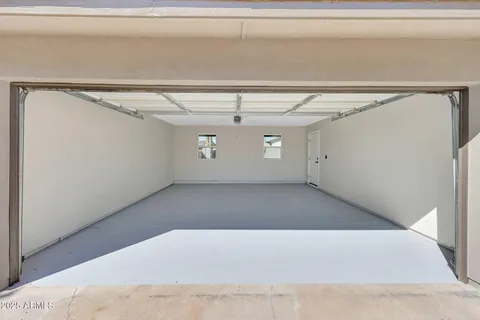 a view of an empty room with a ceiling fan