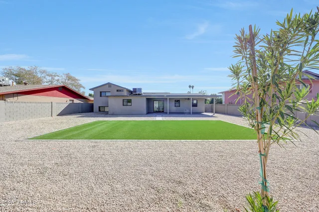 a house with yard in front of it