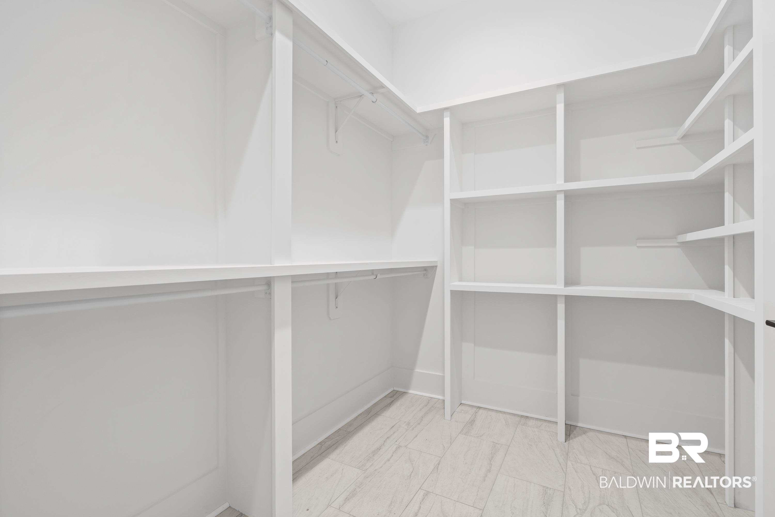 30650 Ono N Loop West Orange Beach, AL 36561 - Photo 19 of 38 Spacious closet featuring marble look tiles