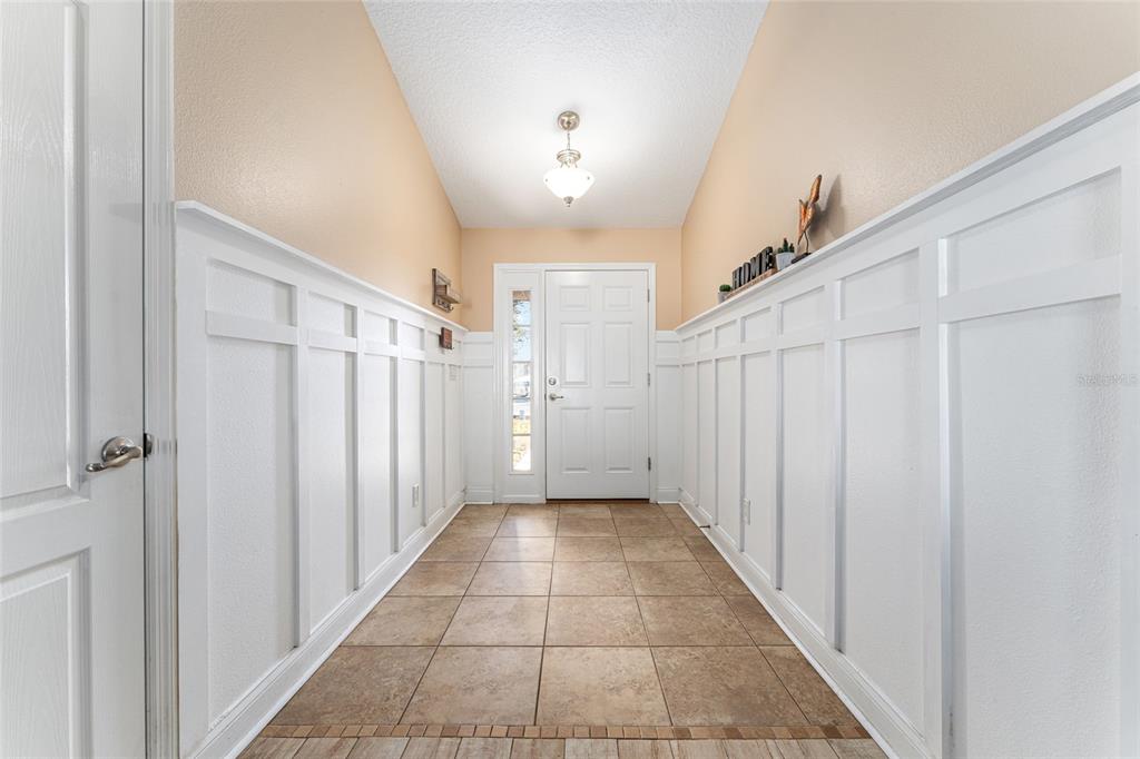 9961 Southwest 55th Ave Road Ocala, FL 34476 - Photo 12 of 89 a view of a hallway with a white walls and stairs