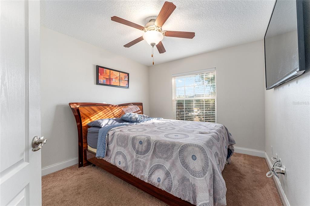 9961 Southwest 55th Ave Road Ocala, FL 34476 - Photo 35 of 89 a bedroom with a bed and a window