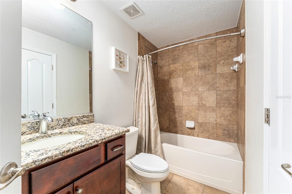 9961 Southwest 55th Ave Road Ocala, FL 34476 - Photo 37 of 89 a bathroom with a granite countertop sink toilet and shower