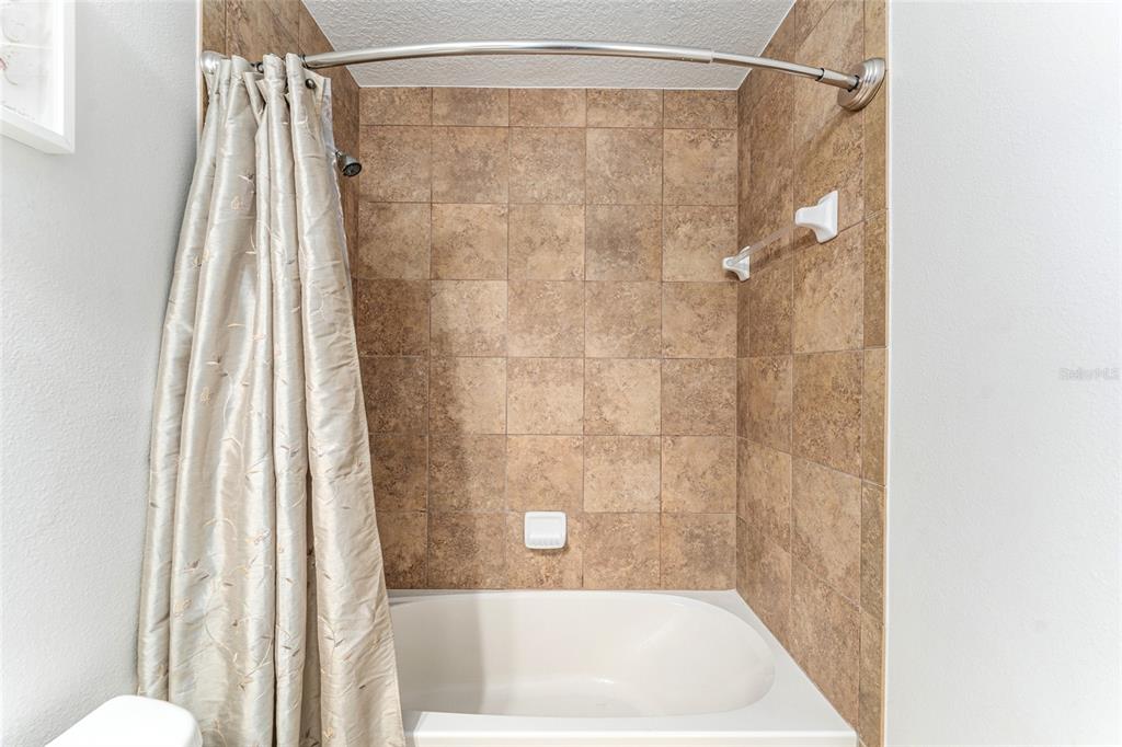 9961 Southwest 55th Ave Road Ocala, FL 34476 - Photo 38 of 89 a bathroom with a shower and a tub