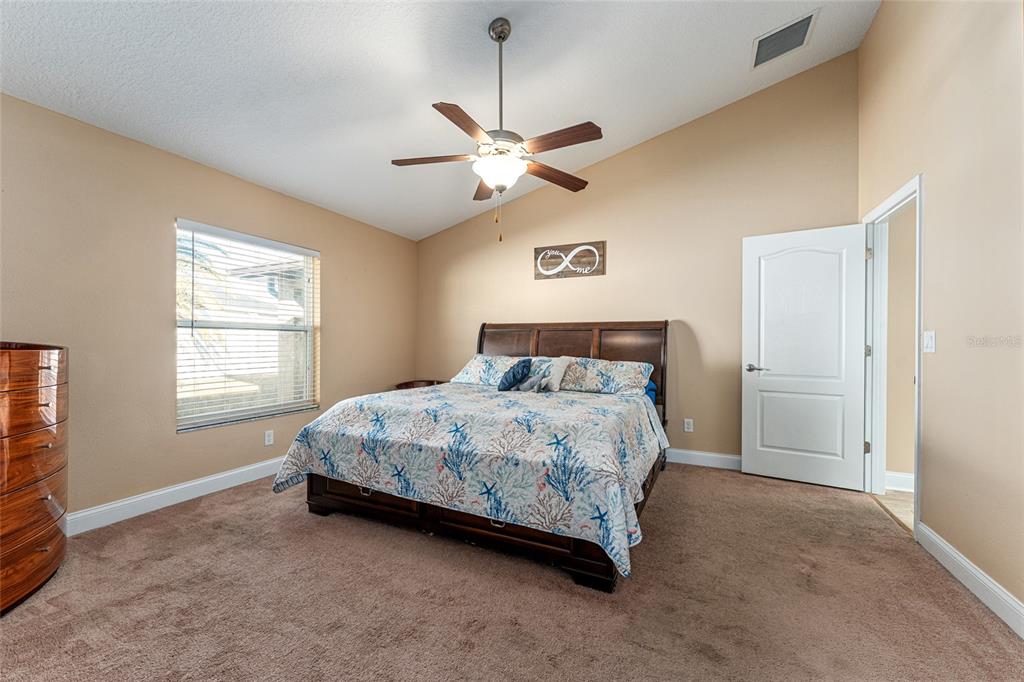 9961 Southwest 55th Ave Road Ocala, FL 34476 - Photo 42 of 89 a bedroom with a bed and window